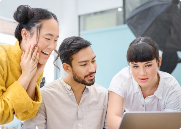 Three person looking at the laptop